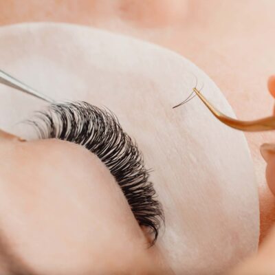 Eyelashes extensions. Eyelash extension procedure in spa beauty salon. Eyelashes extensions. Eyelash extension procedure in spa beauty salon.
